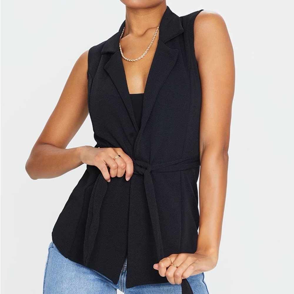 NEW WITH TAGS NEVER WORN black belted sleeveless blazer!
